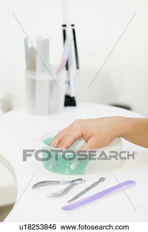 Stock Photograph - Woman having manicure. Fotosearch