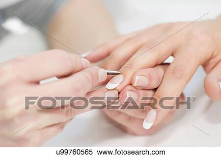 Stock Photography - Woman having manicure. Fotosearch