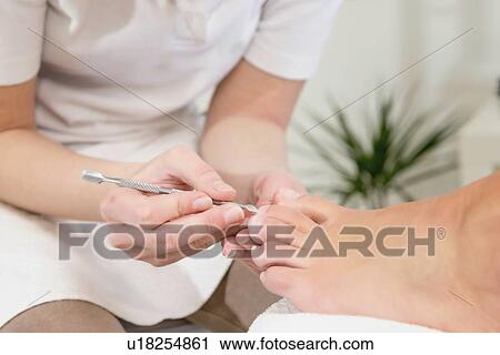 Stock Image - Woman having pedicure. Fotosearch