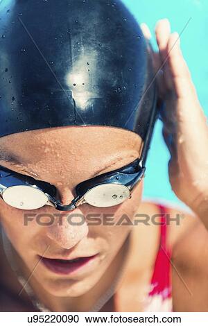 Woman in swimming cap and goggles View Large Photo Image Stock Image - Woman in swimming cap and goggles. Fotosearch