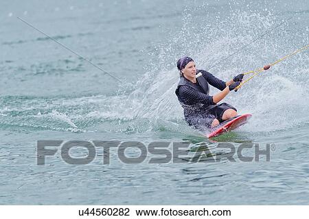 Woman kneeboarding View Large Photo Image Stock Image - Woman kneeboarding. Fotosearch