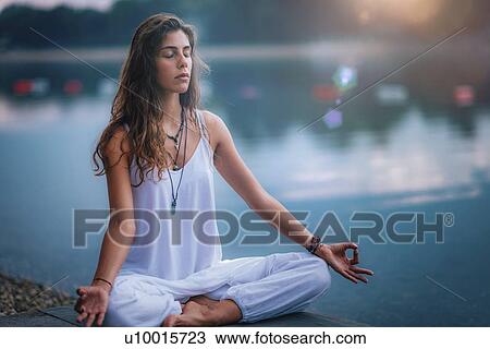 Stock Image - Woman meditating. Fotosearch