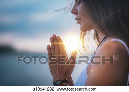 Woman meditating View Large Photo Image Stock Image - Woman meditating. Fotosearch