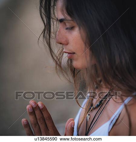 Stock Image - Woman meditating. Fotosearch