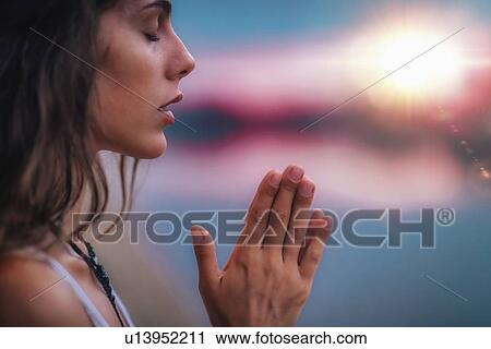Stock Image - Woman meditating. Fotosearch