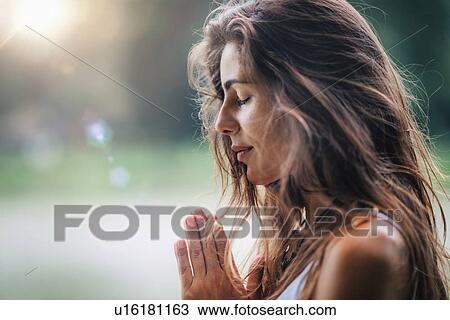 Woman meditating View Large Photo Image Stock Image - Woman meditating. Fotosearch