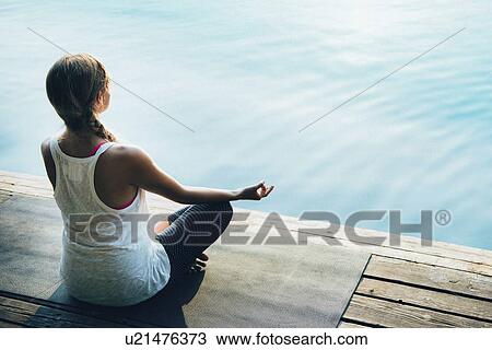 Stock Image - Woman meditating. Fotosearch