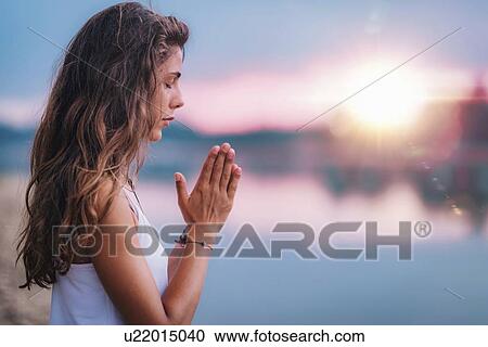 Woman meditating View Large Photo Image Stock Image - Woman meditating. Fotosearch
