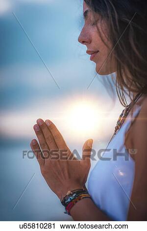 Stock Image - Woman meditating. Fotosearch