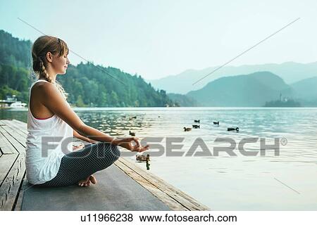 Stock Photo - Woman meditating. Fotosearch