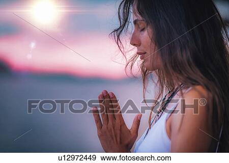 Woman meditating View Large Photo Image Stock Photo - Woman meditating. Fotosearch