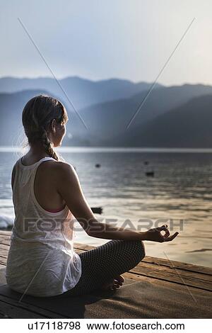 Woman meditating View Large Photo Image Stock Photo - Woman meditating. Fotosearch