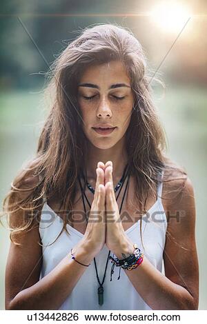 Woman meditating View Large Photo Image Stock Photograph - Woman meditating. Fotosearch