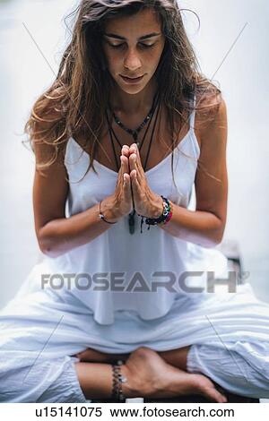 Stock Photography - Woman meditating. Fotosearch
