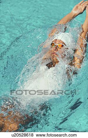 Woman swimming backstroke View Large Photo Image Stock Photo - Woman swimming backstroke. Fotosearch