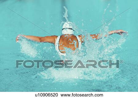 Stock Image - Woman swimming butterfly. Fotosearch