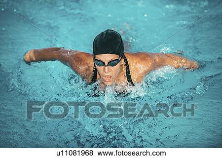 Woman swimming butterfly View Large Photo Image Stock Photo - Woman swimming butterfly. Fotosearch