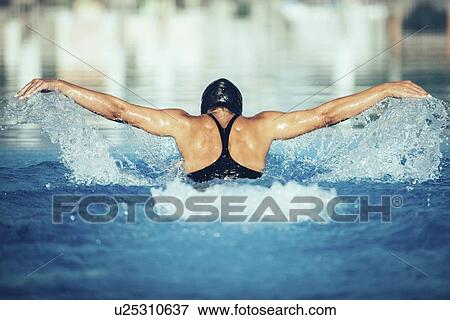 Woman swimming butterfly View Large Photo Image Stock Photo - Woman swimming butterfly. Fotosearch