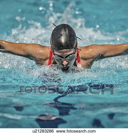 Stock Photograph - Woman swimming butterfly. Fotosearch