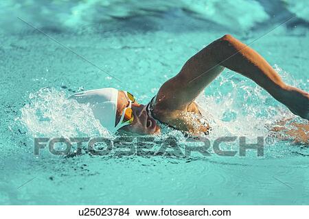 Picture - Woman swimming front crawl. Fotosearch