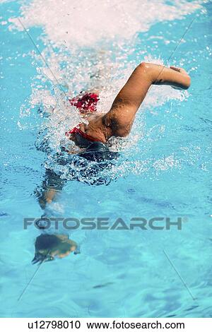 Woman swimming front crawl View Large Photo Image Stock Image - Woman swimming front crawl. Fotosearch