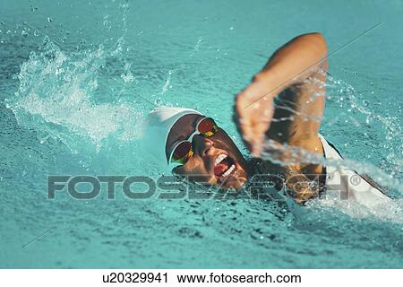 Woman swimming front crawl View Large Photo Image Stock Image - Woman swimming front crawl. Fotosearch