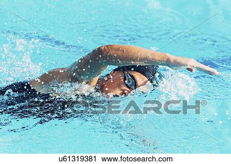 Woman swimming front crawl View Large Photo Image Stock Image - Woman swimming front crawl. Fotosearch