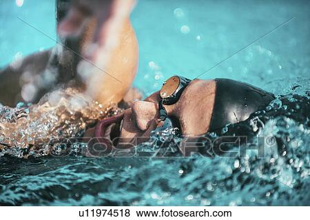 Woman swimming front crawl View Large Photo Image Stock Photo - Woman swimming front crawl. Fotosearch