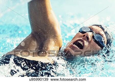 Woman swimming front crawl View Large Photo Image Stock Photo - Woman swimming front crawl. Fotosearch