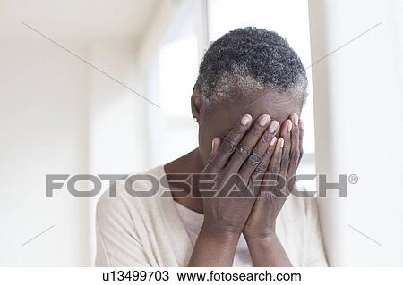 Woman with head in hands View Large Photo Image Stock Image - Woman with head in hands. Fotosearch