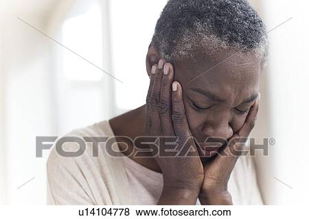 Woman with head in hands View Large Photo Image Stock Photo - Woman with head in hands. Fotosearch