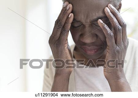 Picture - Woman with headache. Fotosearch