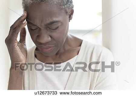 Woman with headache View Large Photo Image Stock Image - Woman with headache. Fotosearch