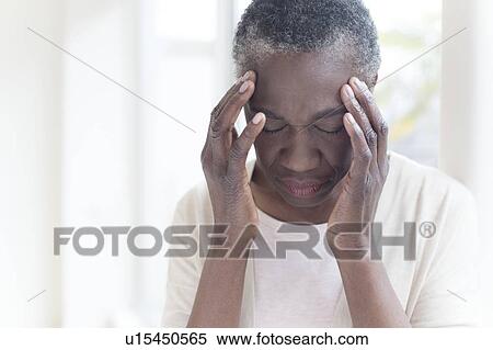 Stock Photography - Woman with headache. Fotosearch