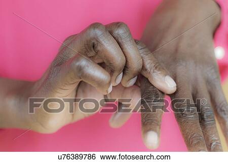 Stock Photograph - Woman with joint pain. Fotosearch