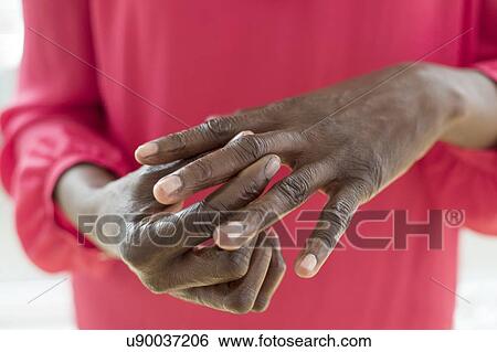 Stock Photograph - Woman with joint pain. Fotosearch