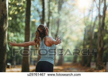 Woman with open arms View Large Photo Image Stock Photo - Woman with open arms. Fotosearch