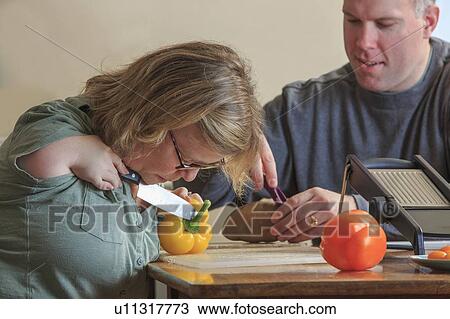 Woman with TAR Syndrome cutting vegetables View Large Photo Image Stock Image - Woman with TAR Syndrome cutting vegetables. Fotosearch