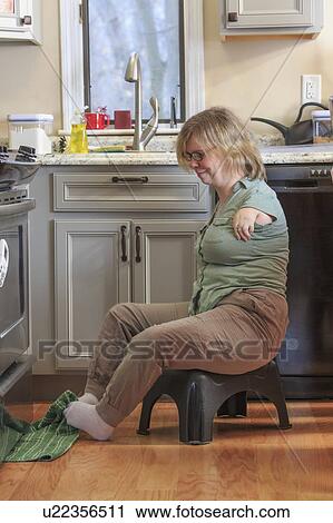 Woman with TAR Syndrome in kitchen View Large Photo Image Stock Image - Woman with TAR Syndrome in kitchen. Fotosearch