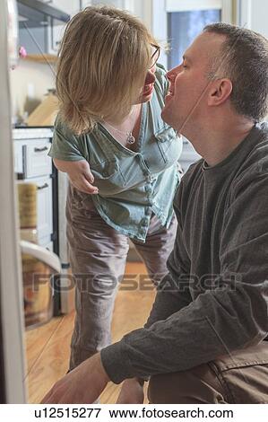 Woman with TAR Syndrome kissing her husband View Large Photo Image Stock Photo - Woman with TAR Syndrome kissing her husband. Fotosearch
