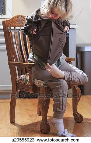 Woman with TAR Syndrome putting on her jacket View Large Photo Image Stock Image - Woman with TAR Syndrome putting on her jacket. Fotosearch