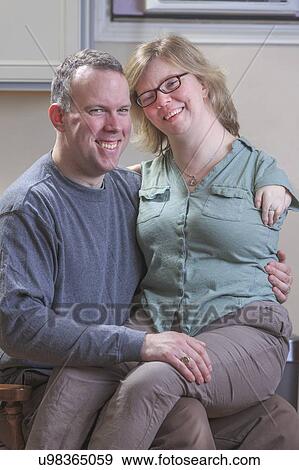 Woman with TAR Syndrome sitting on her husband's lap View Large Photo Image Stock Photo - Woman with TAR Syndrome sitting on her husband's lap. Fotosearch