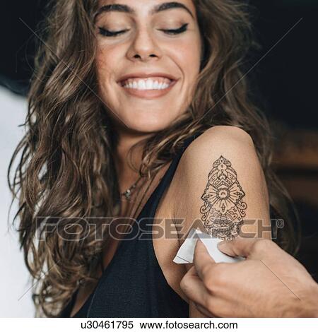 Woman with temporary tattoo View Large Photo Image Stock Photography - Woman with temporary tattoo. Fotosearch