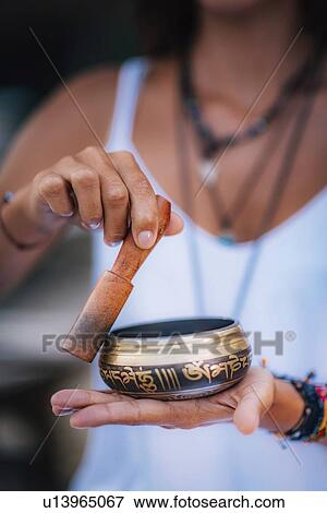 Woman with Tibetan singing bowl View Large Photo Image Stock Photo - Woman with Tibetan singing bowl. Fotosearch