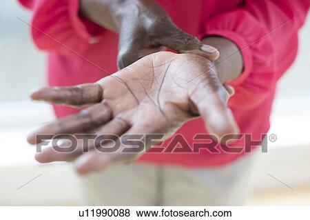 Stock Photo - Woman with wrist pain. Fotosearch