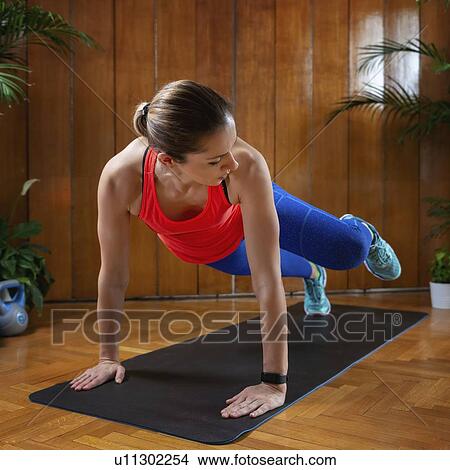 Picture - Woman working out. Fotosearch