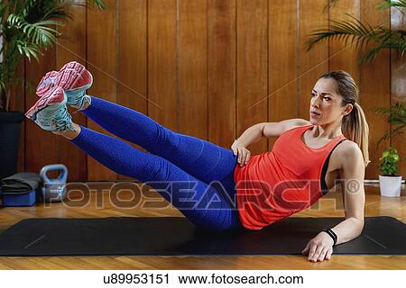 Woman working out View Large Photo Image Stock Image - Woman working out. Fotosearch