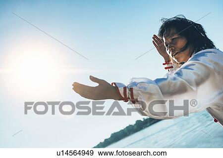 Women practicing tai chi by lake View Large Photo Image Stock Photo - Women practicing tai chi by lake. Fotosearch