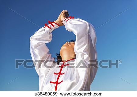 Women practicing tai chi by lake View Large Photo Image Stock Photo - Women practicing tai chi by lake. Fotosearch