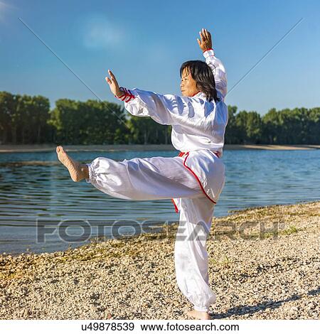 Women practicing tai chi by lake View Large Photo Image Stock Photo - Women practicing tai chi by lake. Fotosearch
